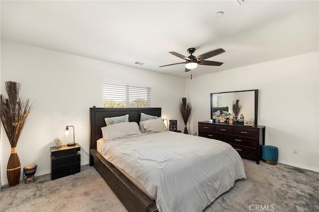 bedroom with light colored carpet and ceiling fan