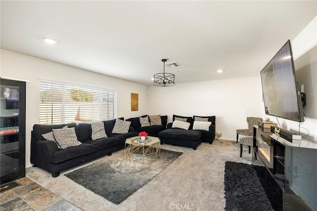 living room with a notable chandelier