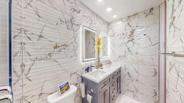 bathroom featuring vanity, radiator heating unit, and toilet