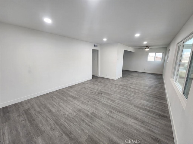 unfurnished room featuring ceiling fan and hardwood / wood-style floors