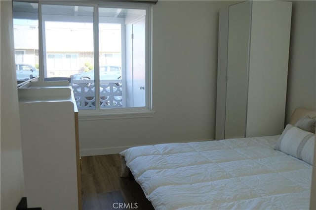 bedroom with hardwood / wood-style flooring