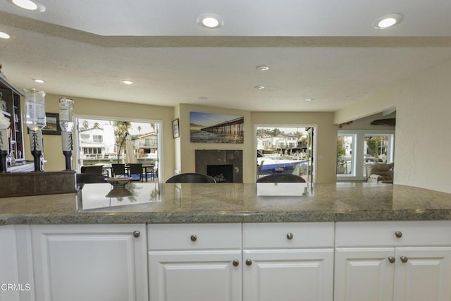 kitchen featuring white cabinetry and kitchen peninsula