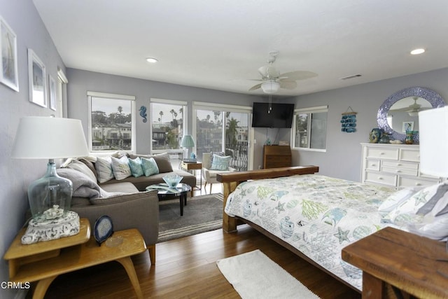 bedroom featuring ceiling fan and dark hardwood / wood-style flooring