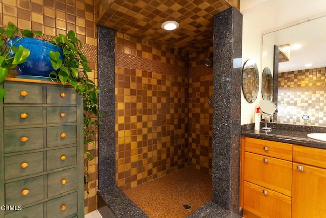 bathroom with vanity and decorative backsplash