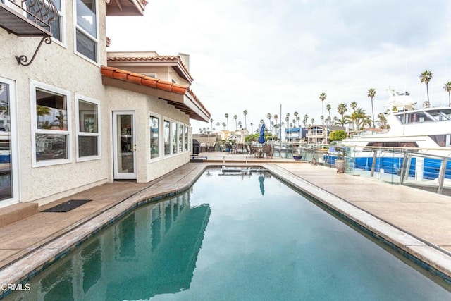 view of swimming pool featuring a patio