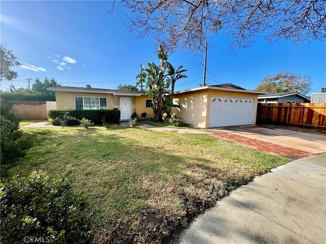 single story home with a garage and a front lawn