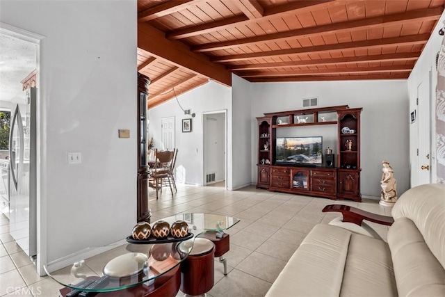 living room with vaulted ceiling with beams, wood ceiling, and light tile patterned floors