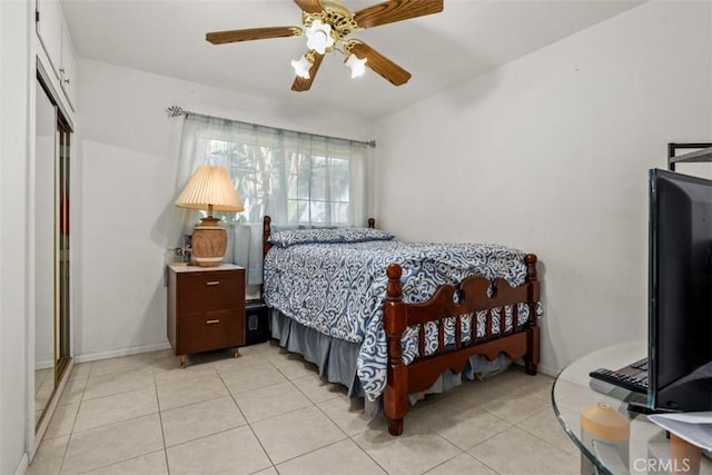 bedroom featuring light tile patterned floors and ceiling fan