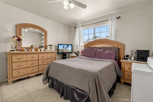 bedroom featuring light tile patterned floors and ceiling fan