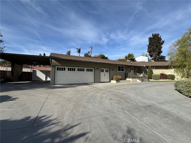 view of front of home featuring a carport and a garage