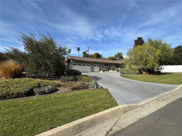 ranch-style house with a garage and a front lawn