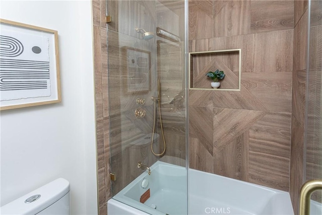 bathroom with enclosed tub / shower combo and toilet