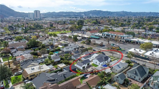 birds eye view of property with a mountain view