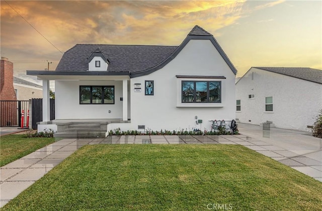 view of front of home featuring a yard