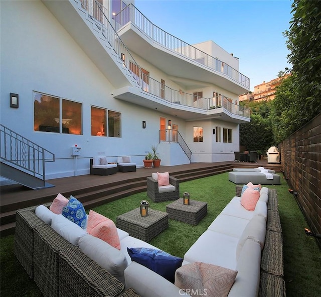 rear view of house with outdoor lounge area