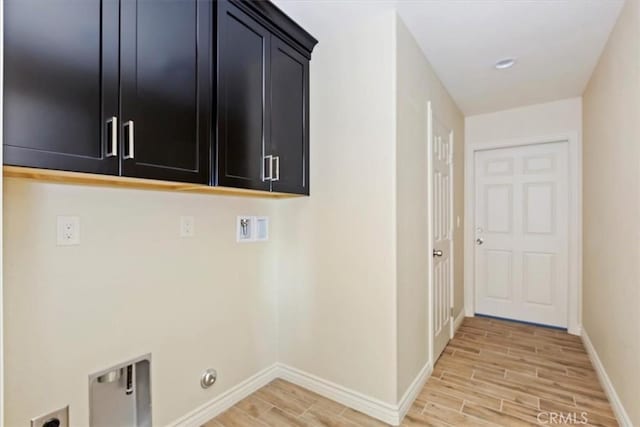 laundry area featuring washer hookup, cabinets, and hookup for an electric dryer