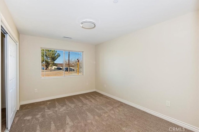 unfurnished room with carpet