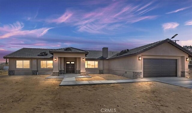 view of front of home featuring a garage