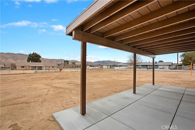 view of patio / terrace featuring a mountain view