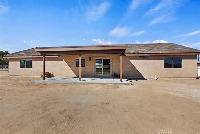 rear view of property featuring a patio area