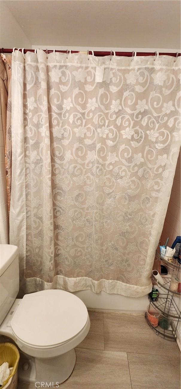 bathroom with tile patterned floors and toilet