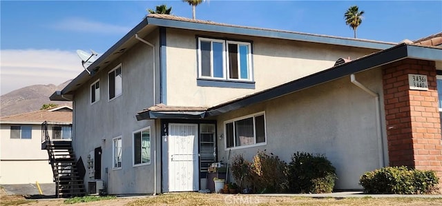 rear view of property with a mountain view