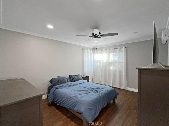 bedroom with crown molding, dark hardwood / wood-style floors, and ceiling fan