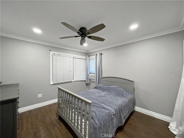 bedroom featuring ornamental molding, dark hardwood / wood-style floors, and ceiling fan