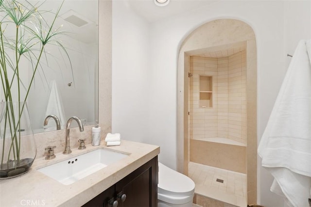 full bathroom with toilet, a shower stall, and vanity