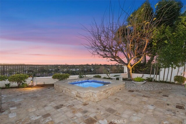 35 Brindisi, Laguna Niguel, CA 92677 - pool at dusk with an in-ground hot tub and a patio