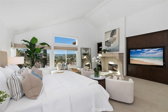 bedroom featuring high vaulted ceiling, carpet flooring, and a lit fireplace