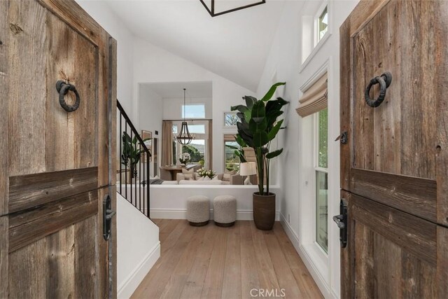 35 Brindisi, Laguna Niguel, CA 92677 - foyer with hardwood / wood-style flooring, plenty of natural light, stairs, and high vaulted ceiling