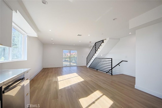 unfurnished living room featuring light wood-type flooring