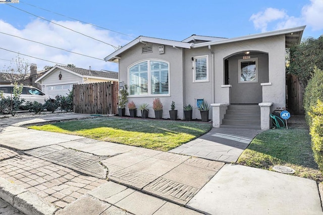 view of front of house with a garage and a front yard