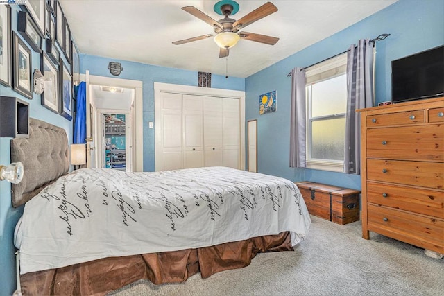 carpeted bedroom with ceiling fan and a closet