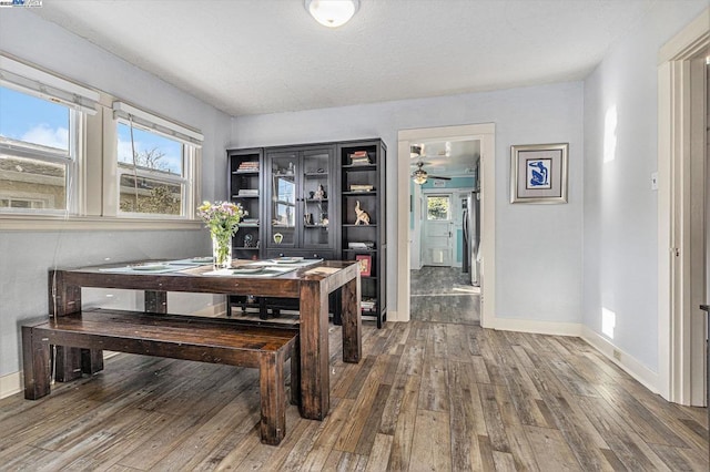 dining area featuring dark hardwood / wood-style floors