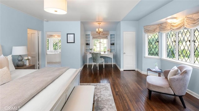 bedroom with multiple windows, an inviting chandelier, and dark hardwood / wood-style flooring