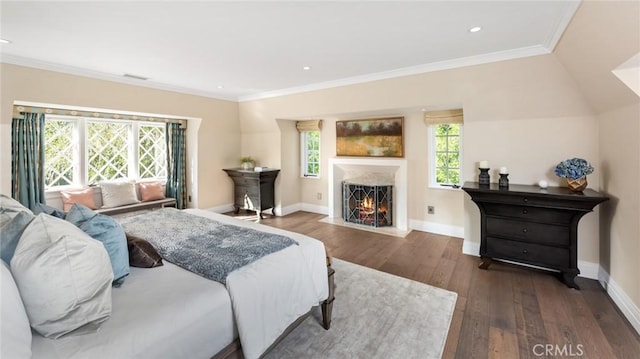 bedroom featuring crown molding, lofted ceiling, dark hardwood / wood-style flooring, and multiple windows