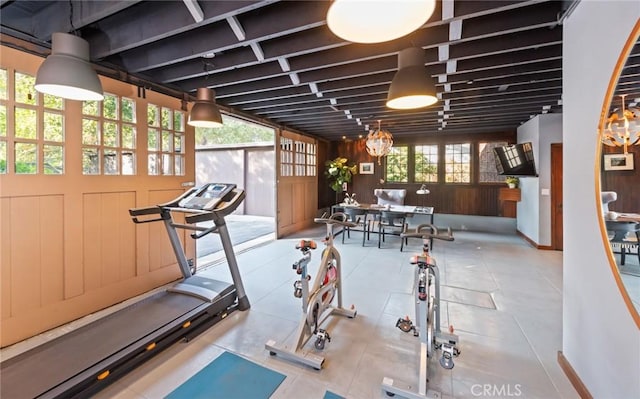 workout area with a notable chandelier