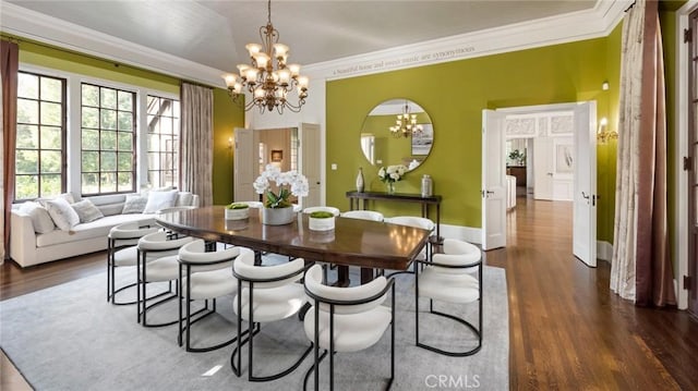 dining area with an inviting chandelier, dark wood-type flooring, and ornamental molding