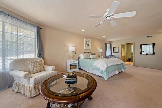 bedroom with light carpet and ceiling fan