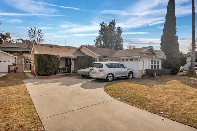 ranch-style home with a garage and a front yard