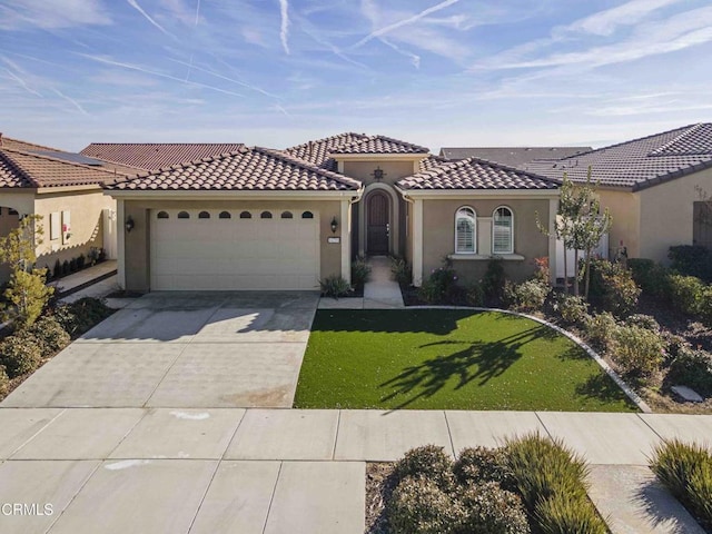 mediterranean / spanish-style house with a garage and a front lawn