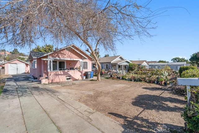 view of front of home featuring a shed