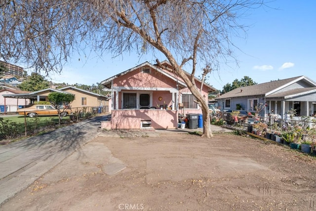 bungalow featuring a fenced front yard