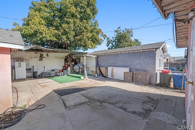 view of patio / terrace featuring fence