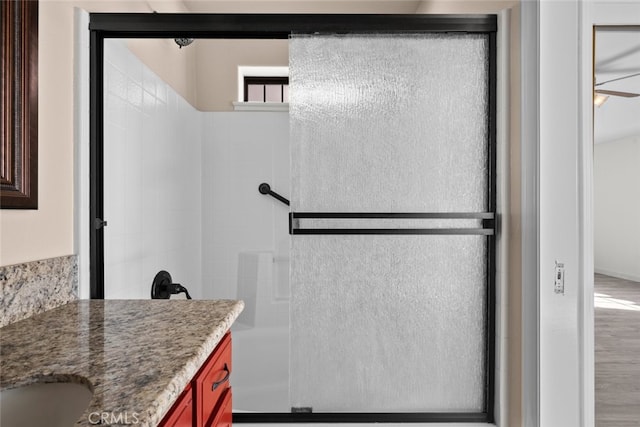 bathroom with vanity and an enclosed shower