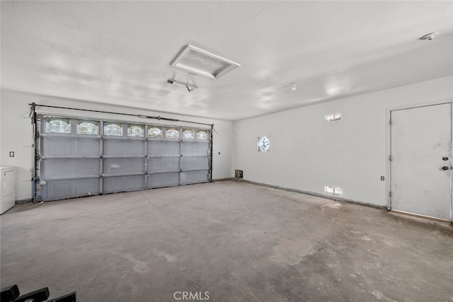 garage with separate washer and dryer