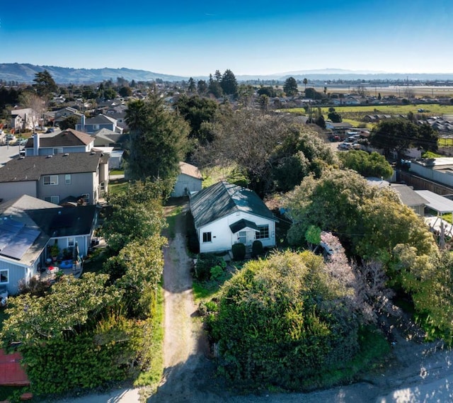 birds eye view of property with a mountain view