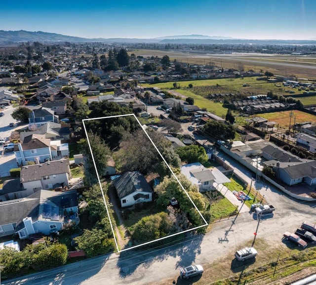 birds eye view of property with a mountain view